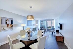 Living room, balcony access, Tv, dining area