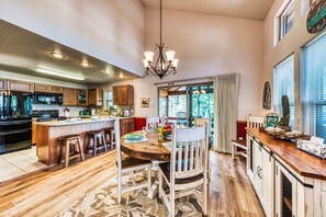 Enjoy meals in the cozy dining area, featuring seating for four and a convenient counter — the perfect spot for dining and socializing.