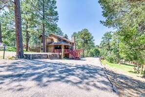 Nestled right beside the road, this charming cabin facade offers easy access and a warm, inviting entrance to your perfect getaway.