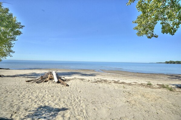 Large, private sandy beach with shallow entry.  Perfect for children.