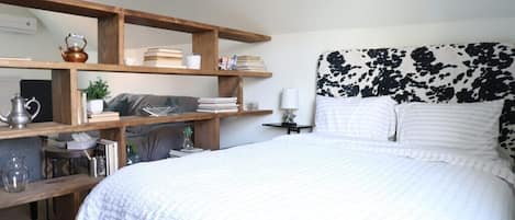 Nestled away in a quiet area in the middle of the city, the carriage house apartment is located on the second floor. 