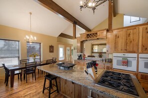 Ranch style kitchen.  Six burner gas range, standard and convection oven.