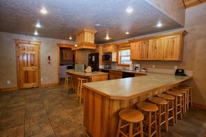 Kitchen with doors to half bath and laundry room.