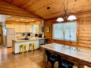 Open concept between dining, living, and kitchen