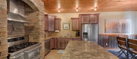 Granite counters, stainless appliances, pot fill faucet.