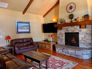 Bright living room with west facing balcony.