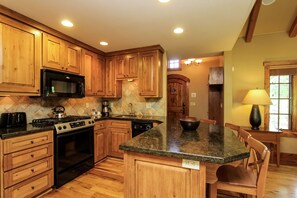 Clearwater Cottage 87 at Tamarack Resort -  a full kitchen with space for 4 at the breakfast bar.