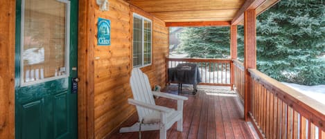 Hubbard Cabin McCall vacation rental with wood stove, covered porch, Traeger grill and hot tub.