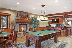 Game room with pool table and poker table