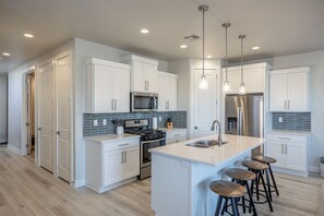 Kitchen Island - The Kitchen Island comfortably seats 4 adults and creates a great space for serving and preparing meals.