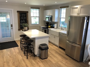 Modern kitchen with stainless appliances. 