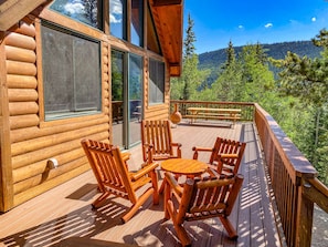 The huge deck provides plenty of space to enjoy the beauty that surrounds the home!