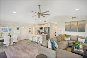 Masterful living room with large couch for spreading out and reclining! Ocean views from the windows and a big screen Smart TV with streaming apps and basic cable!
