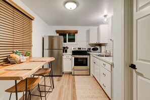 A fully stocked kitchen with plenty of utensils, dishes & basic ingredients