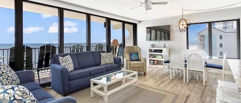 Spacious Open Living Area with Sofa and Love Seat with a Queen Size Sleeper Sofa and floor to ceiling views of the Gulf of Mexico