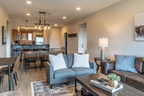 The open living room flows into the dining area & kitchen