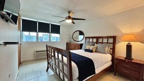 Master bedroom includes a Queen size bed, AC, Smart TV & a private full bathroom