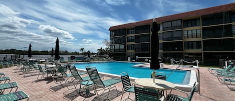 Sundeck with plenty of lounge chairs and tables, and view of the - Sundeck with plenty of lounge chairs and tables, and view of the intercoastal water of Indian Shores. Perfect for relaxing in the sun and hanging out by the heated pool and hot tub!