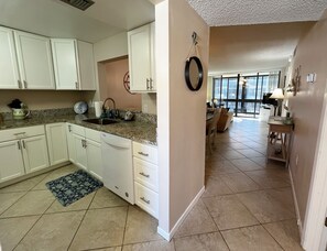 Entrance into this second floor condo with two separate master s - Entrance into this second floor condo with two separate master suites and a full kitchen.