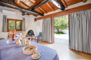 Dining and living area with direct access to patio