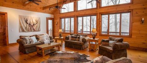 Great Room with Wood Floors, Vaulted Ceilings, Exposed Beams, Leather Furniture