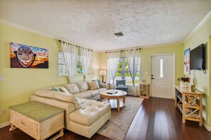 Livingroom with large leather L-shaped couch