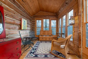 Main entry into enclosed sunroom porch.