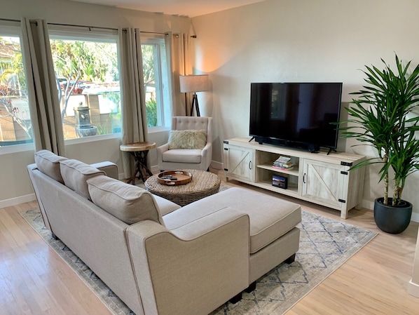 Comfortable living room where you can watch your favorite movies on the Smart TV