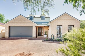 Treat the family to a private oasis filled with fun and games while being within walking distance to beach and town.