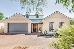 Treat the family to a private oasis filled with fun and games while being within walking distance to beach and town.