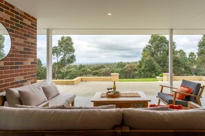 Unwind on the spacious alfresco patio with stunning valley views—perfect for sunset drinks or casual outdoor dining.