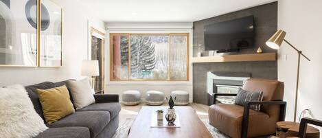 Living room with views of aspen tree groves