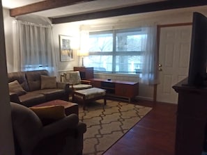 Living room with large screen tv and electric fireplace