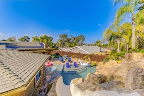 Huge 20' custom slide lands into 8 foot deep of perfectly heated saltwater pool.