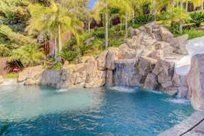 Enjoy the  roaring waterfall and 20' slide in our 8' deep saltwater pool.