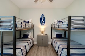 Third bedroom with Smart TV is a fun beach retreat for younger guests.