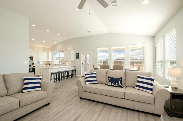 Spacious open-concept living for family time and beachside comfort.