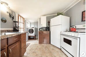 Kitchen and laundry. Note: Laundry has been updated with stacked W/D 