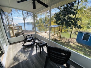 Screened in side porch is perfect for a quiet morning coffee!
