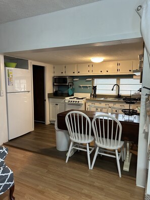Kitchen view from Living room
New larger refrigerator (late 2021), new flooring 