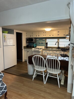 Kitchen view from Living room
New larger refrigerator (late 2021), new flooring 