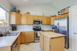 Our kitchen is fully stocked for your home-cooked meal, with cookware and dishes ready to use.