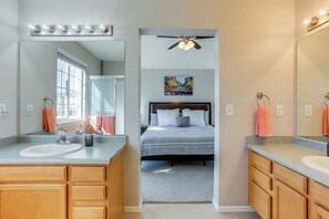 Upstairs master bathroom with spacious layout and double sinks for convenience.