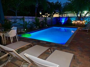 The main pool area by night 