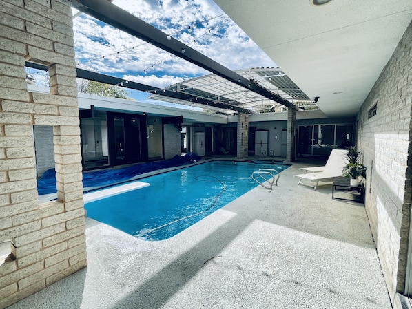 Indoor heated (optional) pool with retractable roof!! Unique find!!
