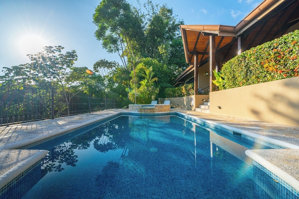 Large swimming pool with smaller plunge pool for sitting and relaxing 