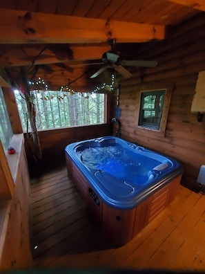 Enjoy the screened-in deck with a hot tub.
