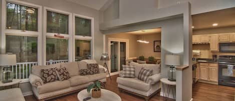 Comfortable living room with fireplace and large 65” TV