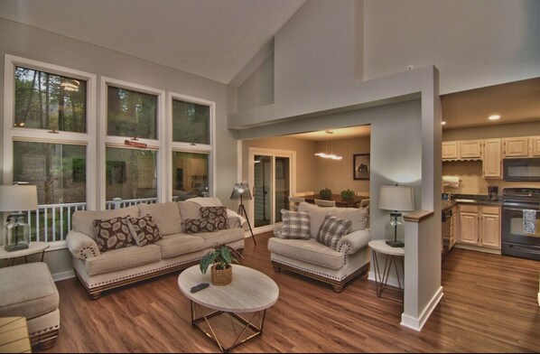 Comfortable living room with fireplace and large 65” TV