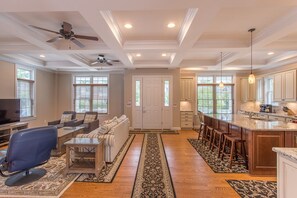 Living room - On-site sanding hardwood floor throughout.